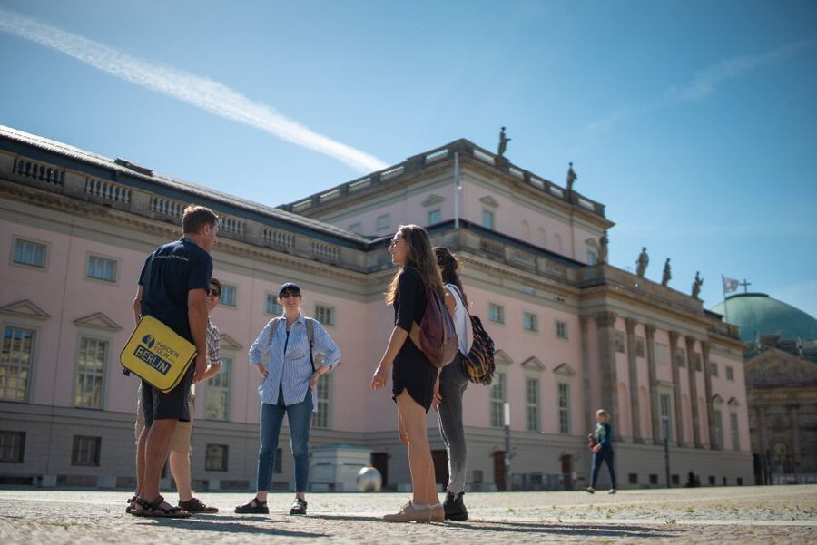 Explore Berlin: Walking Tour of All The Iconic Sites - Touching the Berlin Wall brings the Cold War closer